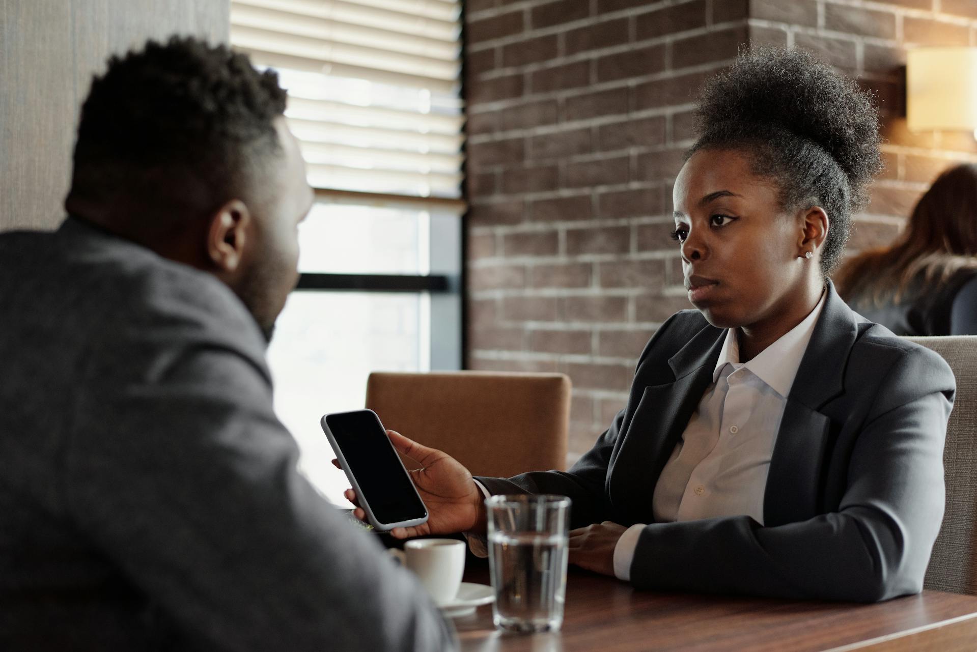 Two people setting on table